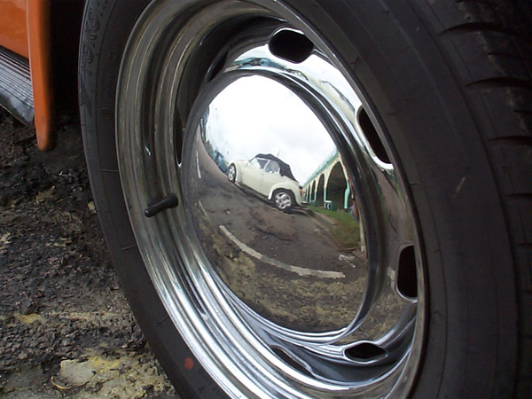 Karmann Beetle reflected in a Beetle's hubcap